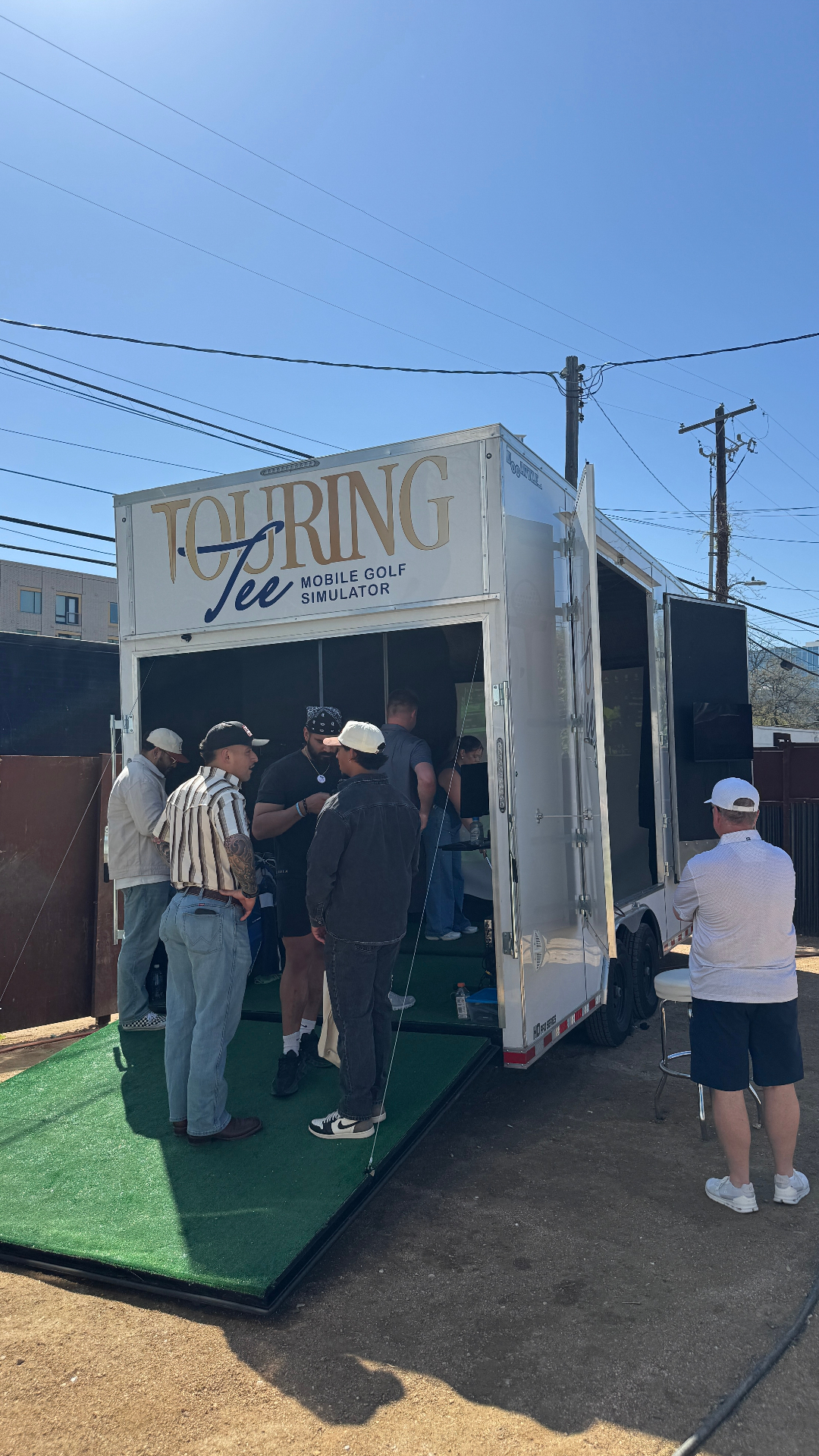 Touring Tee trailer set up at a live event with guests